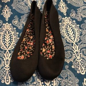 Black satin-like flats